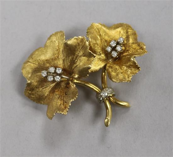 An 18ct gold and diamond set flower brooch, makers mark PG, and numbered 5492, 40mm.
